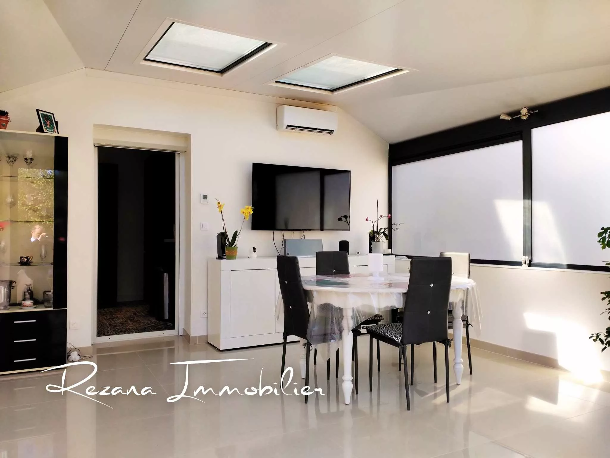 véranda aménagée pièce de vie maison Héricy